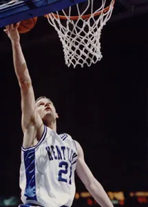Cameron Mills, number 21, going up for a layup in a Kentucky uniform